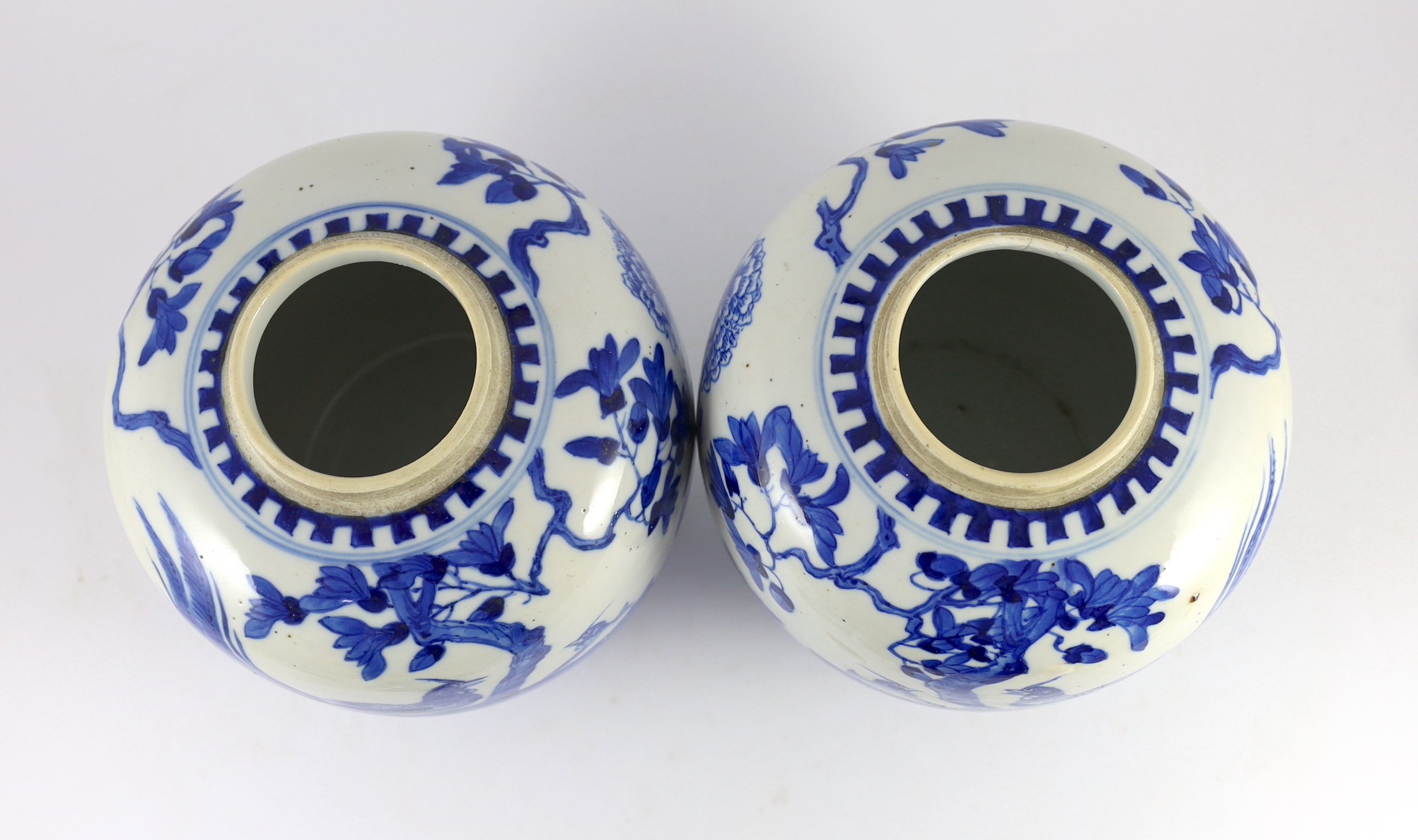 A pair of Chinese blue and white jars and covers, 19th century, 25cm high